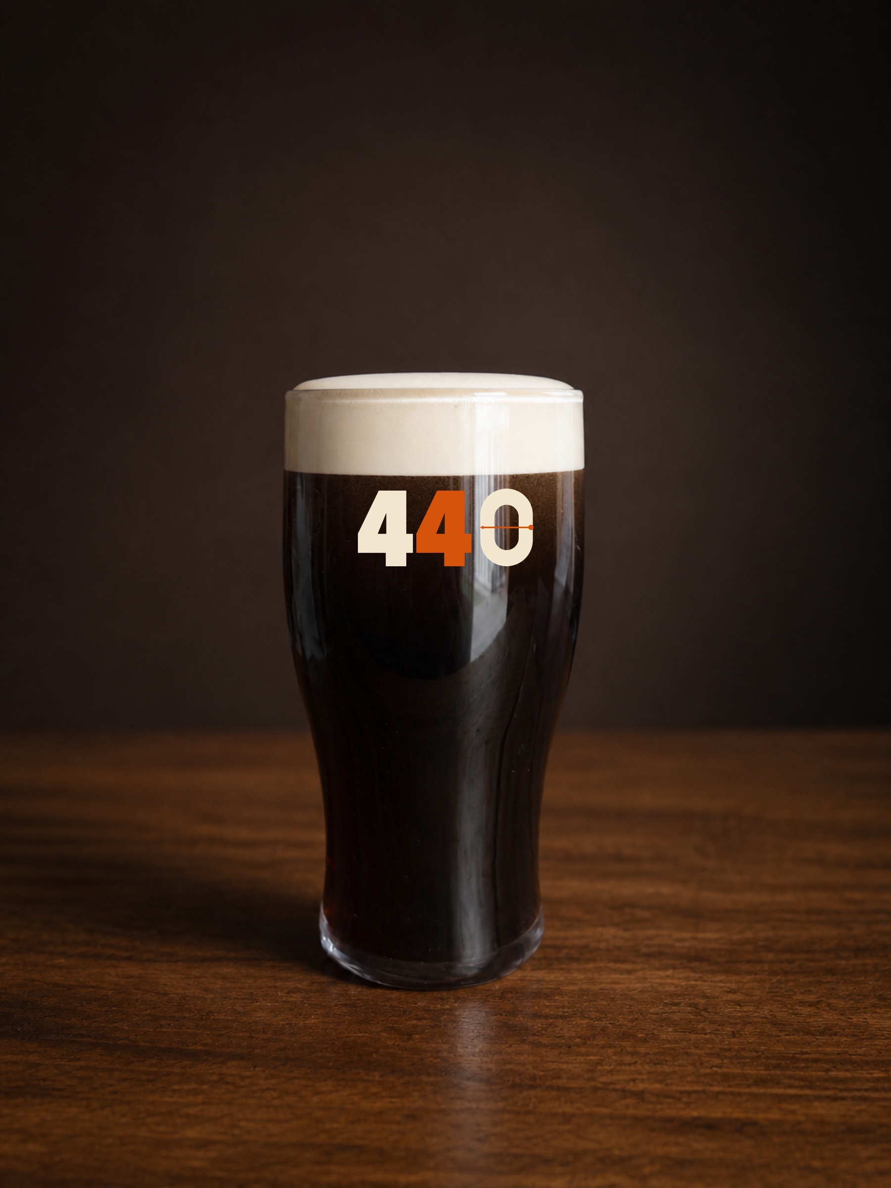 The Four Forty tulip glass filled with stout and showing the proposed 440 Hit the Pin print